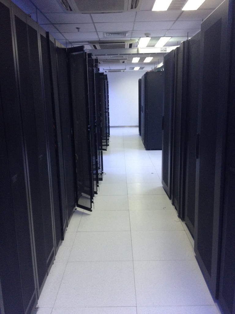 Aisle of closed server racks in a data center