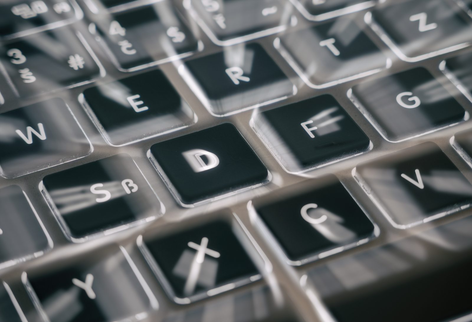 Close-up of a laptop keyboard with the D key in focus