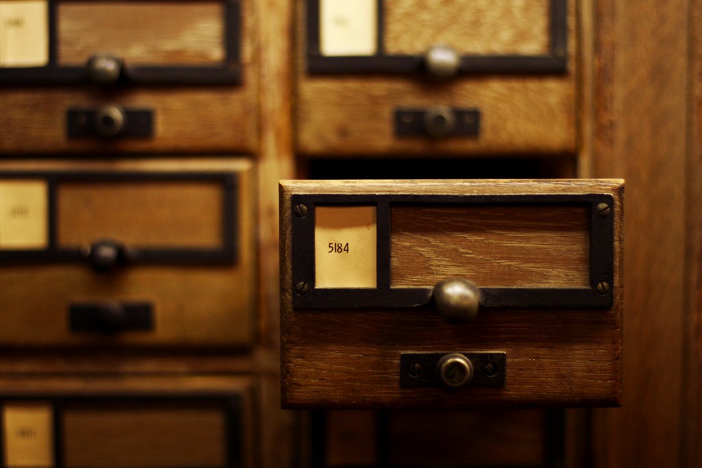 Open wooden library card-catalog drawer labeled 5184